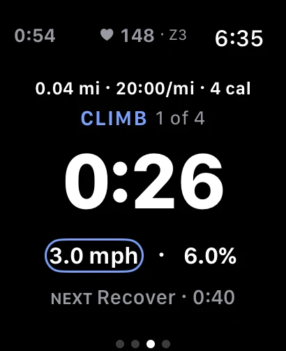 Apple Watch mid-interval, showing the CLIMB segment 1 of 4, a 0:26 countdown, targets of 3.0 mph at 6.0 percent incline, and a heart rate of 148 in zone 3.
